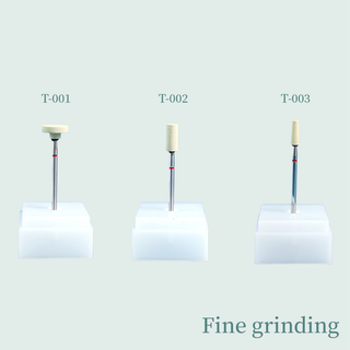 Three fine grinding rotary tool heads labeled T-001, T-002, and T-003 on white stands